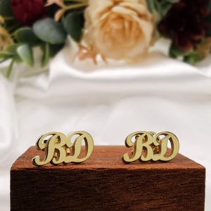 May include: A set of three ceramic nesting bowls in shades of blue, green, and white. The bowls feature a speckled glaze and a simple, modern design. The largest bowl measures approximately 6 inches in diameter.