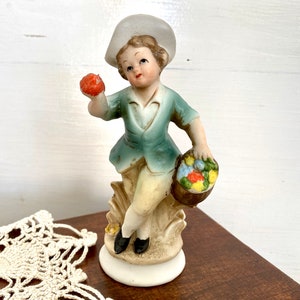 Antique hand painted bisque figurine German bisque boy with fruit basket
