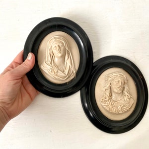 Antique French meerschaum religious pair wall plaque 1800s Jesus Christ and Virgin Mary, black oval frames vintage bedside decor