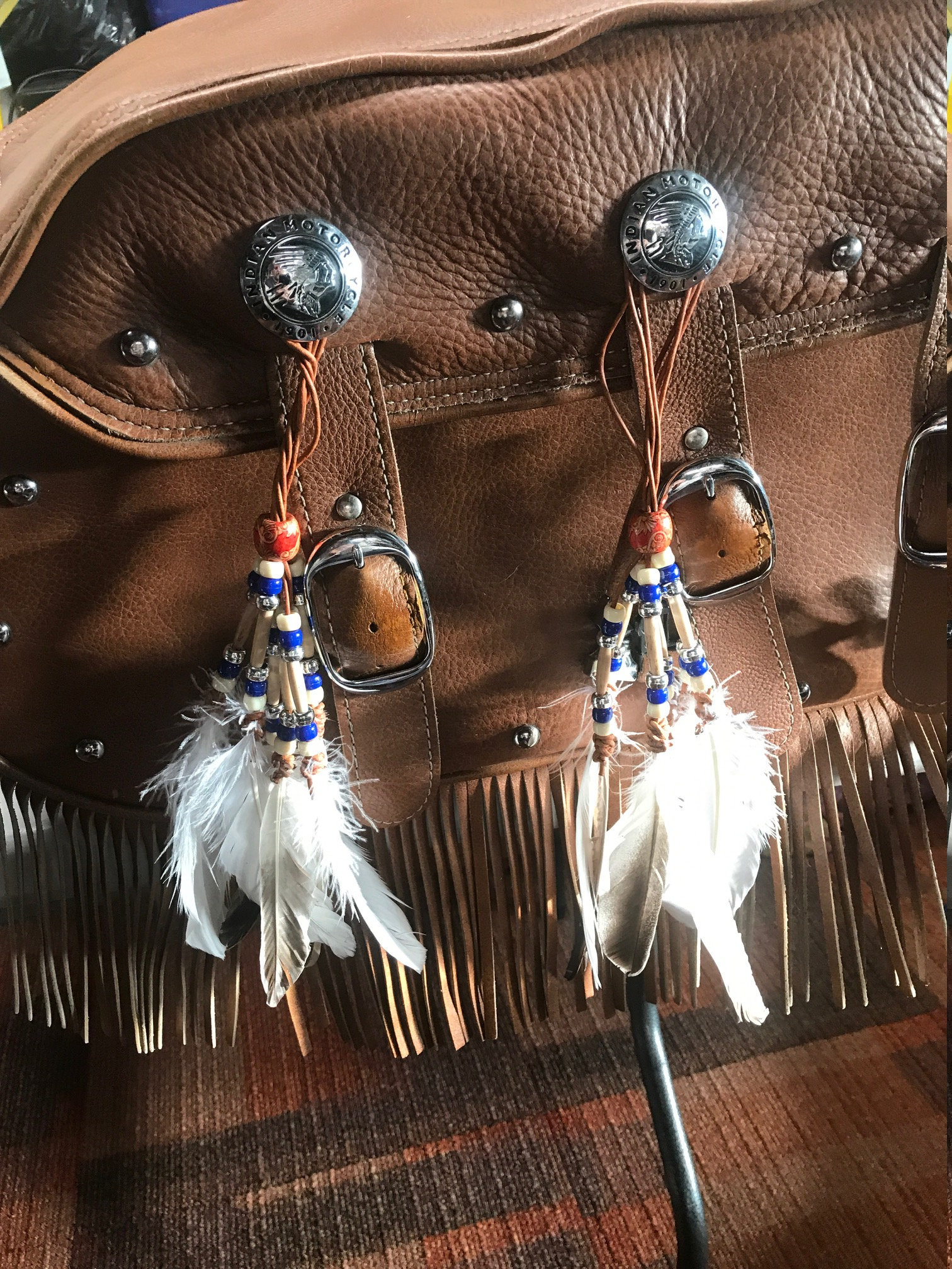 Feather beaded conchos