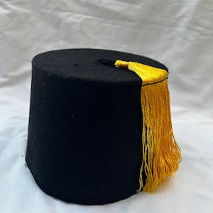 Fez turco egipcio negro Tarboush de alta calidad con borla amarilla de 57 cm