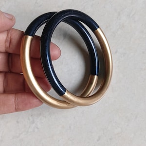 resin black bangle with golden colour