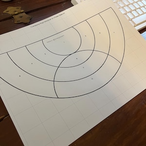 May include: A black and white printable pattern for a stained glass project called "Overlapping Rings Semicircle" with the text "Pattern #1 Overlapping" and numbered sections.