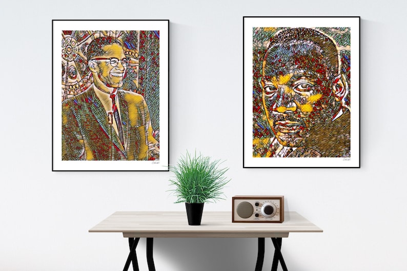 May include: Two framed black and white portraits of famous African American men. The portraits are in a stylized, pixelated style with a yellow, red, and blue color scheme. The portraits are hanging on a white wall above a wooden table with a green plant and a vintage radio.
