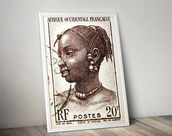 May include: A vintage postage stamp from the French West African colony of Côte d'Ivoire, featuring a brown and white illustration of a woman's face with a beaded necklace. The stamp is labelled "AFRIQUE OCCIDENTALE FRANCAISE" and "RF POSTES 20F".