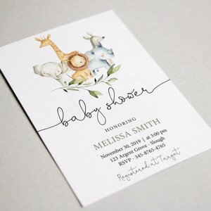 May include: A baby shower invitation with a watercolor illustration of a giraffe, lion, elephant, and rhinoceros surrounded by green leaves. The text reads "baby shower" and "honoring Melissa Smith". The date, time, location, RSVP information, and registry information are also included.
