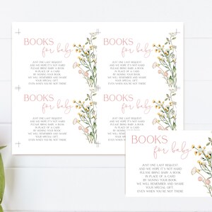 May include: White baby shower invitation cards with floral illustrations and the text "Books for baby." The cards feature a watercolor design with pink and yellow flowers and green leaves. The text is in a soft pink color.