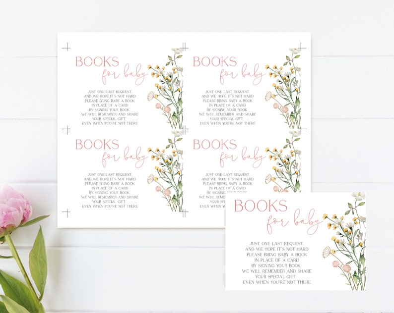 May include: White baby shower invitation cards with floral illustrations and the text "Books for baby." The cards feature a watercolor design with pink and yellow flowers and green leaves. The text is in a soft pink color.