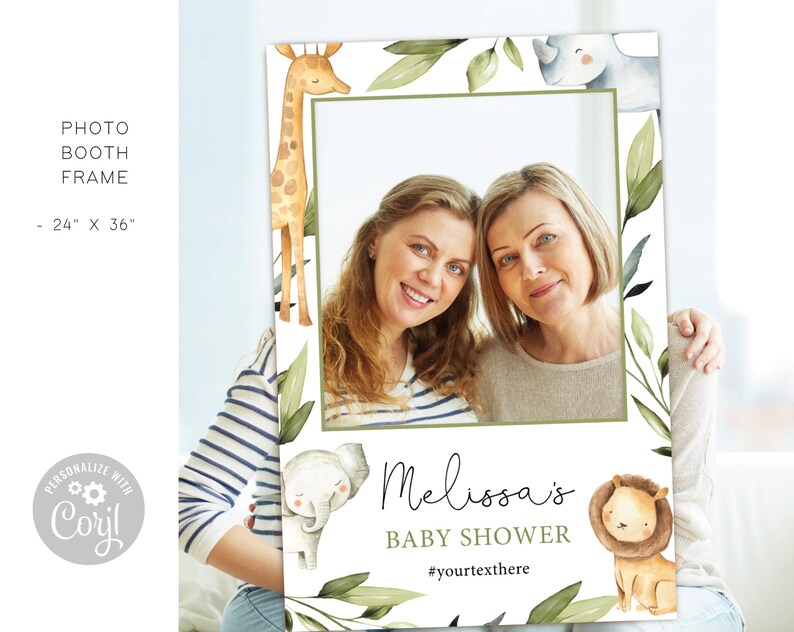 May include: A white photo booth frame with a green leafy border and watercolor illustrations of a giraffe, rhino, elephant, and lion. The frame has a space for a photo and text that says "Melissa's Baby Shower #yourtextthere".