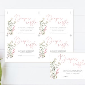 May include: White diaper raffle cards with floral accents. The cards feature the text "Diaper raffle" in a cursive font, along with instructions and a space for a name. The design includes watercolor-style flowers.