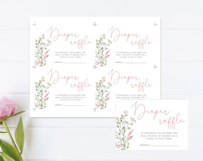May include: White diaper raffle cards with floral accents. The cards feature the text "Diaper raffle" in a cursive font, along with instructions and a space for a name. The design includes watercolor-style flowers.