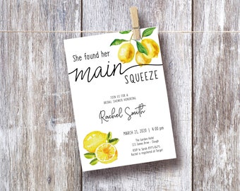 May include: A white card with a lemon illustration and the text "She found her main squeeze" and "Join us for a bridal shower honoring Rachel Smith". The card also includes the date, time, location, RSVP information, and registry information.