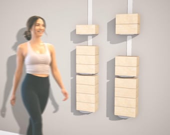 May include: Two vertical wall-mounted storage units featuring light-colored wooden rectangular blocks stacked on white metal tracks. Each unit consists of multiple wooden segments arranged in a column, providing a modular shelving system.