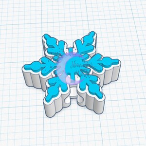 May include: A 3D printed snowflake ornament in white and light blue. The snowflake has a 3D effect with raised edges.
