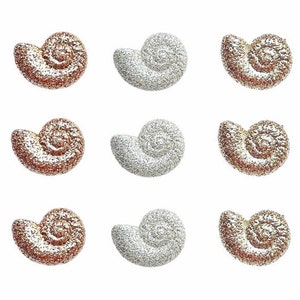May include: Nine small seashells with a glittery finish. Three are silver, three are gold, and three are rose gold.