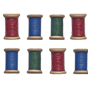 May include: Eight spools of thread in red, blue, and green. The spools are made of wood and have a metal cap on each end.