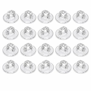 May include: A set of twenty clear, round plastic buttons arranged in four rows of five. Each button features a smooth, circular base and a prominent, arched shank with a single hole for threading, designed for attachment to garments.