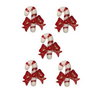 May include: Five red and white candy cane ornaments with red glitter bows. The candy canes are white with red stripes and the bows are red with gold glitter.