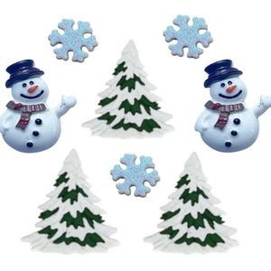 May include: A set of ten Christmas-themed buttons featuring two snowmen, four pine trees, and four snowflakes. The snowmen are white with black eyes, red scarves, and black hats. The pine trees are green with white snow on them. The snowflakes are white with a glittery finish.