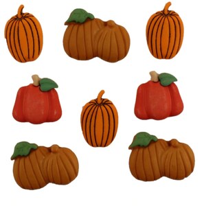 May include: Assortment of nine decorative pumpkin buttons in various shades of orange and brown. The buttons feature a three-dimensional design and are perfect for adding a touch of fall charm to crafts and projects.