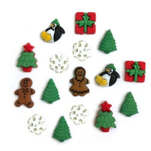 May include: Assortment of Christmas-themed buttons featuring a gingerbread person, penguins, Christmas trees, snowflakes, and presents. The buttons are made of plastic and have a variety of colors, including red, green, white, and brown.