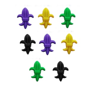 May include: Eight plastic fleur-de-lis charms in black, green, purple, and yellow.
