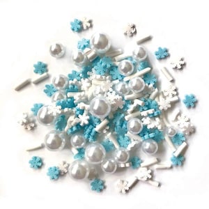 May include: A mix of white and blue snowflake sprinkles and white pearl sprinkles. The sprinkles are perfect for decorating cakes, cupcakes, and other desserts.