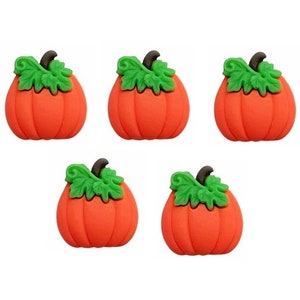 May include: Five orange pumpkins with green leaves. The pumpkins are small and have a 3D appearance.