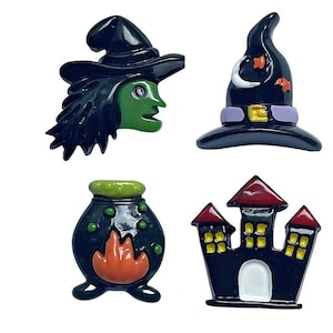 May include: Four Halloween themed resin embellishments. A witch with green skin and black hair, a black witch hat with a purple band, a black cauldron with a green top and orange flames, and a black castle with red and yellow details.