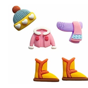 May include: A set of five winter-themed clay charms, including a pink jacket, a purple and pink scarf, a blue and yellow hat, and two yellow boots.