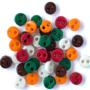 May include: Assortment of small, round, two-hole buttons in various colors, including red, green, brown, orange, and white.