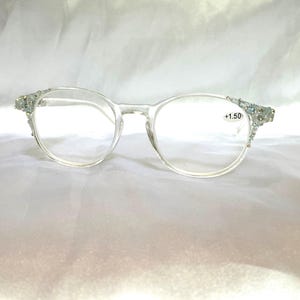 Reading glasses. Clear, classic frame, genuine blue topaz and Swarovski crystal embellished, unique women’s readers. Strength, +1.50.