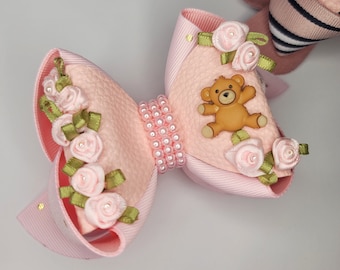 Pink teddy bear hair bow with pearls and satin flowers and faux leather