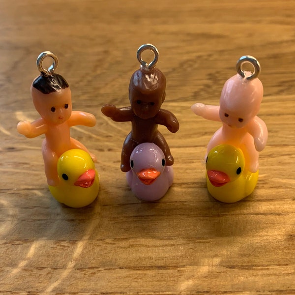 Outrageous baby dolls riding ducks earrings!