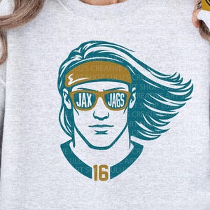 May include: A light gray sweatshirt featuring a teal and gold graphic of a person wearing sunglasses with the text "JAX JAGS". The number "16" is below the graphic. The words "SVG/PNG" are at the bottom.