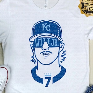 May include: A white t-shirt with a blue and white illustration of a baseball player wearing a cap with the letters "KC" and the number "7" on the front. The player is wearing sunglasses and has a mustache. The text "WITT JR." is above the sunglasses. The text "LULU'S Creative ArtShop ORIGINAL ARTIST" is in a circle with a star in the upper right corner of the image.