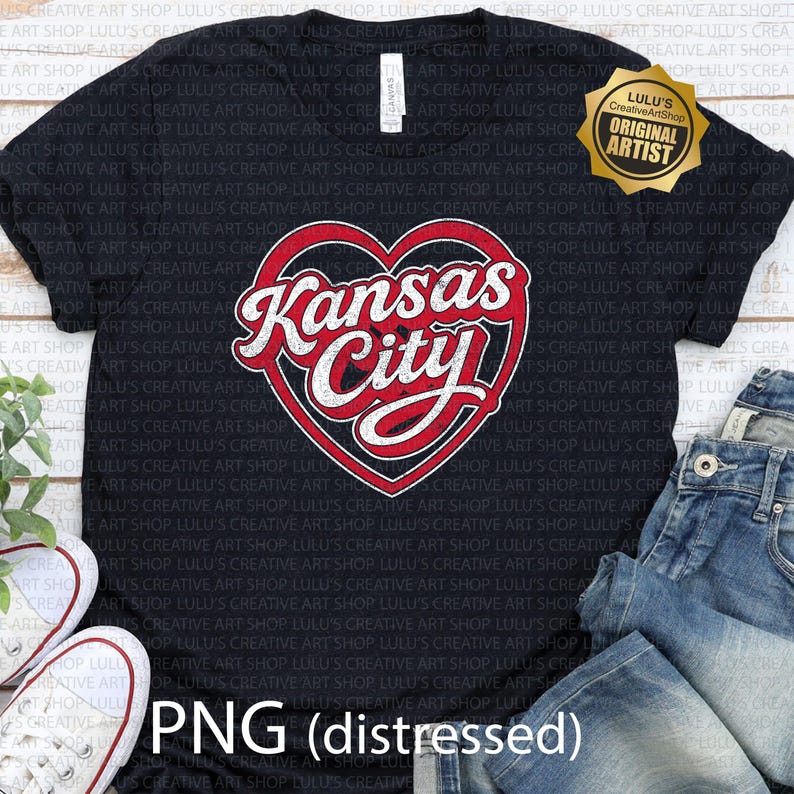 May include: Black t-shirt featuring a distressed red and white heart design with "Kansas City" text. The shirt includes a gold "Original Artist" seal and the text "PNG (distressed)".