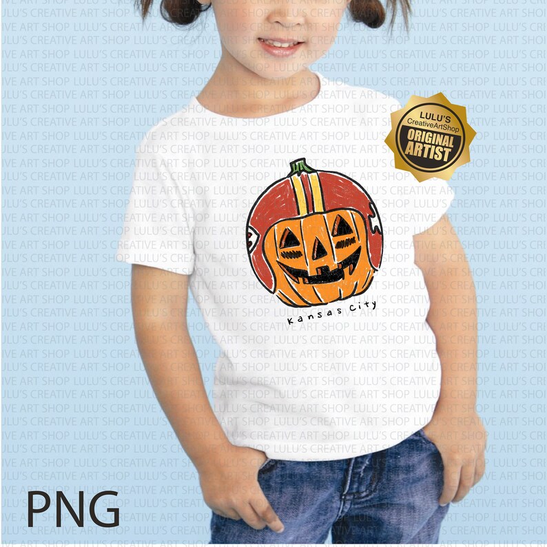May include: White t-shirt featuring a cartoon pumpkin wearing a football helmet with the text "Kansas City". The design is in orange, red, and yellow. Includes a gold "Original Artist" badge.