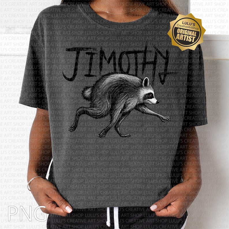 May include: A dark gray short-sleeve t-shirt featuring a black ink-style illustration of a raccoon in a running pose. Above the raccoon, the word JIMOTHY is printed in a bold, hand-drawn black font. A gold-colored badge reads ORIGINAL ARTIST.