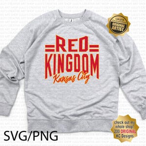 May include: A gray sweatshirt with the text "=RED= KINGDOM Kansas City" in red and yellow lettering. The sweatshirt has a crew neck and long sleeves. A gold star with the text "LULU'S Creative ArtShop ORIGINAL ARTIST" is in the upper right corner of the image.