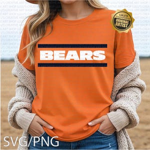 May include: Orange t-shirt with the word "BEARS" in white block letters, framed by navy blue stripes. The shirt features a gold "Original Artist" seal. The bottom of the image displays "SVG/PNG".