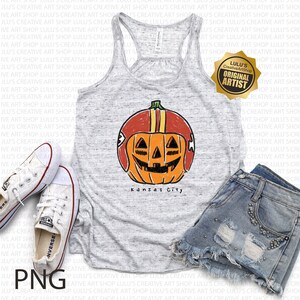May include: A gray tank top with a graphic of a jack-o'-lantern wearing a football helmet. The text "Kansas City" is below the pumpkin. White Converse sneakers and denim shorts are also in the image.