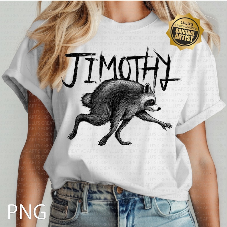 May include: A white short-sleeve t-shirt featuring a black ink-style illustration of a raccoon in a running pose. Above the raccoon, the text JIMOTHY is printed in a bold, jagged, hand-drawn black font. A gold-colored badge is in the top right corner.