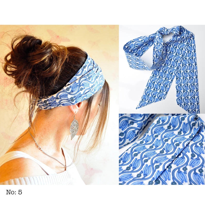 May include: A blue and white patterned headband and scarf set. The fabric features a repeating floral design. The headband is worn around the head, and the scarf is displayed tied. The set is a stylish accessory.