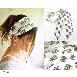 May include: White headband with a green floral pattern. The headband is worn by a person with brown hair. The image also shows a close-up of the headband and its pattern. The text "No: 4" is at the bottom left.
