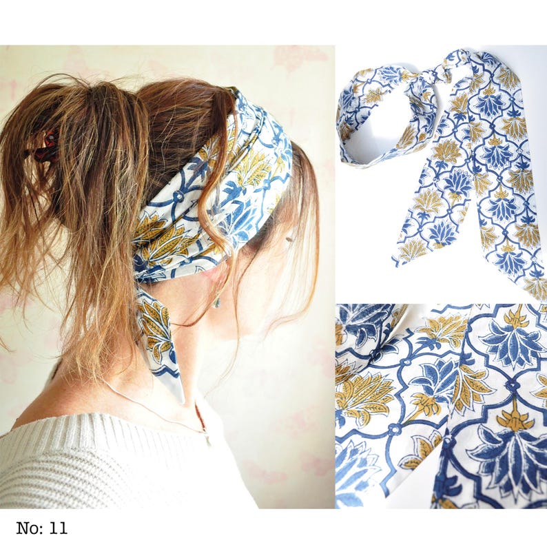 May include: A white headband with a blue and gold floral pattern is tied around a person's hair. The headband is made of fabric and has long, flowing ends. The image also shows a close-up of the fabric's pattern and the text "No: 11".