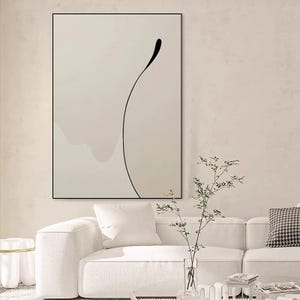Puede incluir: Impresi&oacute;n de arte abstracto con una l&iacute;nea negra sobre un fondo marr&oacute;n claro. La impresi&oacute;n est&aacute; enmarcada en un marco negro y est&aacute; colgada en una pared blanca.