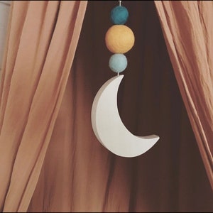 Solid wood moon suspension and felted wool balls