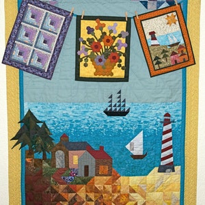 May include: A colourful quilt with a seascape design. The quilt features a lighthouse, a sailboat, a ship, and a house. The quilt is made of various fabrics and colours, including blue, green, yellow, and red.