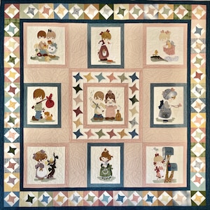 May include: A patchwork quilt with a blue border and a white background. The quilt features nine squares with different images of children in various poses. Each square has a white border and a pink background. The quilt is made of cotton fabric and is machine washable.